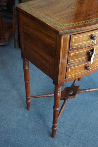 A Regency brass inlaid rosewood bowfront drop leaf work table, width 54cm, depth 36cm, height 70cm